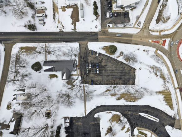 08_aerial_building_and_parking_east.webp
